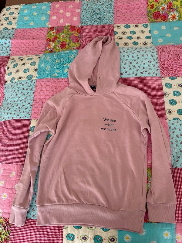 Herren Rosa Hoodie mit Aufdruck „We see what we want.“ – Größe XXS