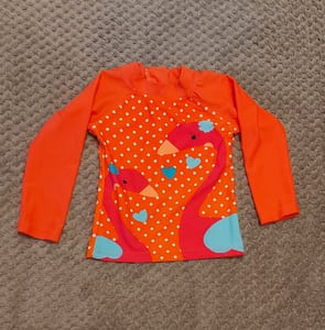 Mädchen Langarm-Badeshirt mit Flamingo-Motiv, Orange mit weißen Punkten – Größe 74